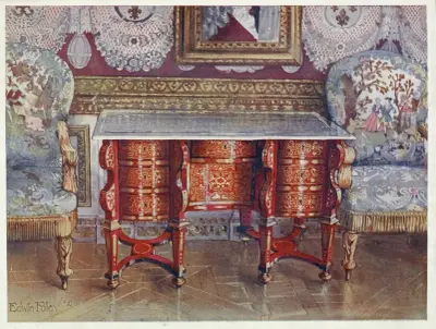 Kneehole writing table in red tortoiseshell. Lacquer steel top. Boulle. Gilt fauteuils, upholstered in tapestry av Edwin Foley