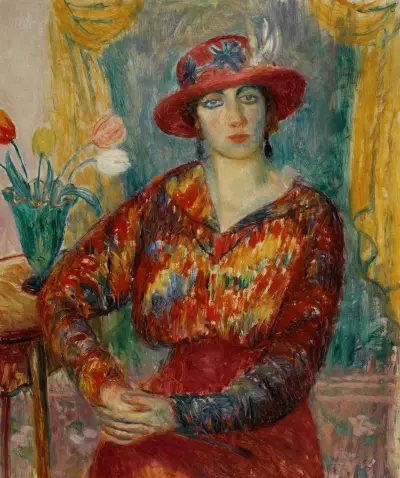 Woman in Red Blouse with Tulips av William James Glackens
