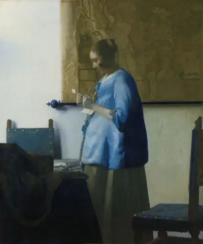 Woman Reading a Letter av Johannes Vermeer