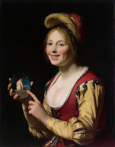 Smiling Girl, a Courtesan, Holding an Obscene Image av Gerard van Honthorst