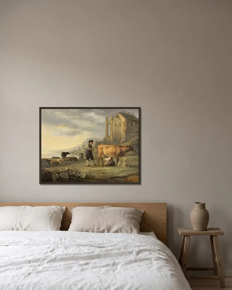 Landskap med mjölkande piga och ko av Aelbert Cuyp inramad på en vägg