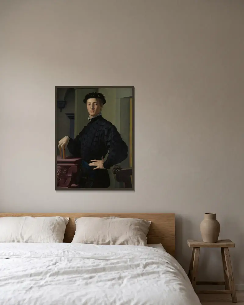 Portrait of a Young Man av Agnolo Bronzino inramad på en vägg