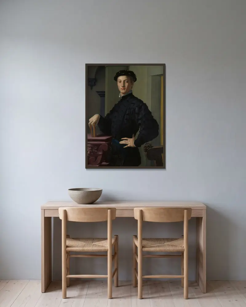Portrait of a Young Man av Agnolo Bronzino inramad på en vägg
