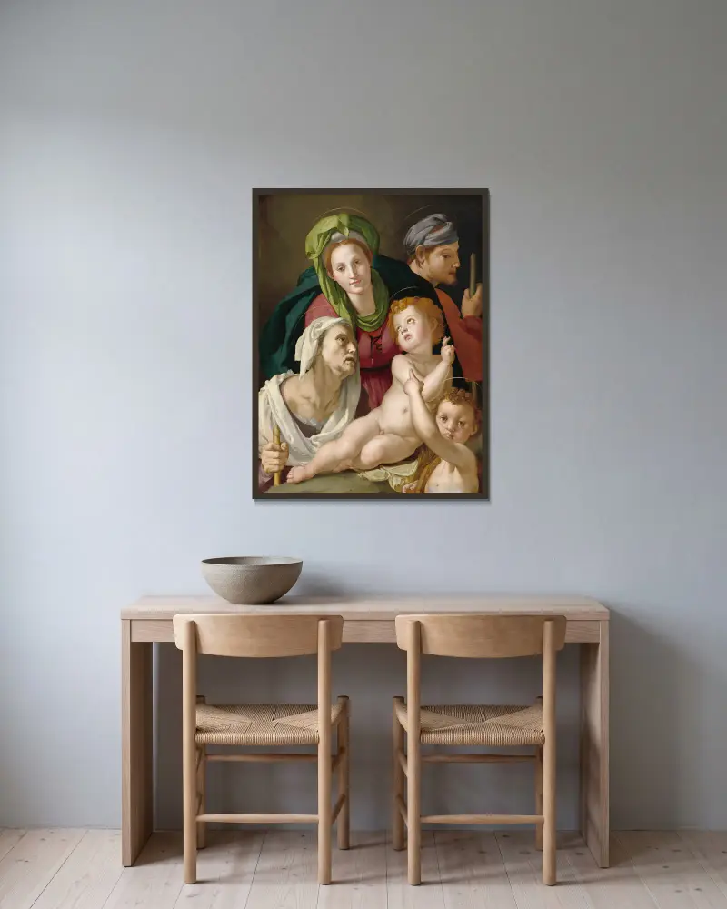 The Holy Family av Agnolo Bronzino inramad på en vägg