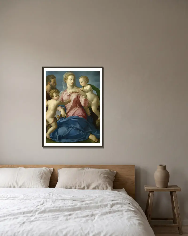 The Holy Family with the Infant Saint John the Baptist av Agnolo Bronzino inramad på en vägg