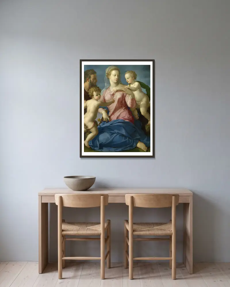The Holy Family with the Infant Saint John the Baptist av Agnolo Bronzino inramad på en vägg
