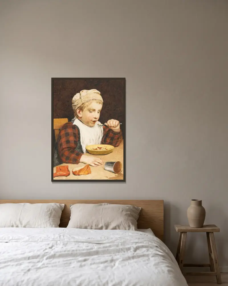 Pojke med mössa vid maten av Albert Anker inramad på en vägg