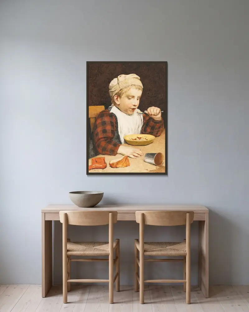 Pojke med mössa vid maten av Albert Anker inramad på en vägg