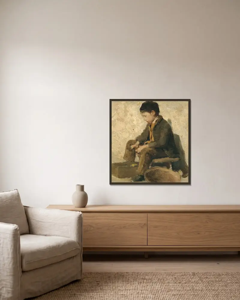 Sitzender Junge beim Gemüseschälen von Albert Anker gerahmt an einer Wand
