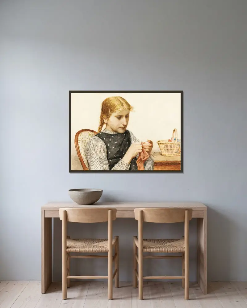 Strickendes Mädchen von Albert Anker gerahmt an einer Wand