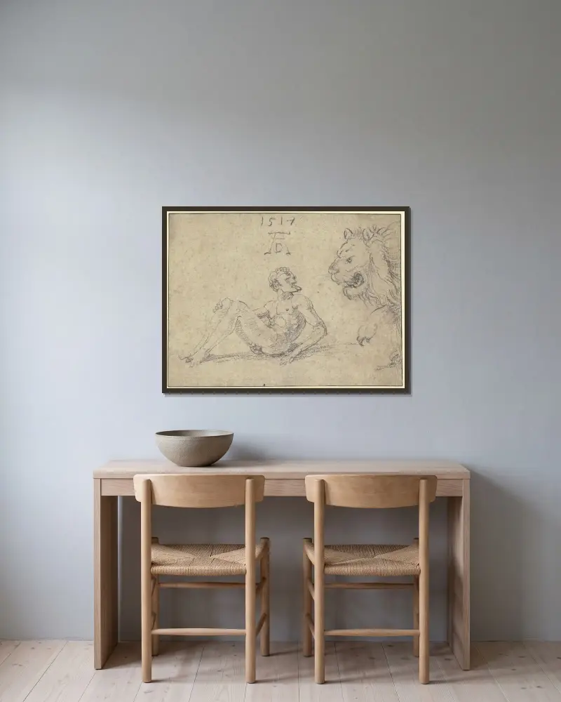 Sitzender nackter Mann mit einem Löwen von Albrecht Dürer gerahmt an einer Wand