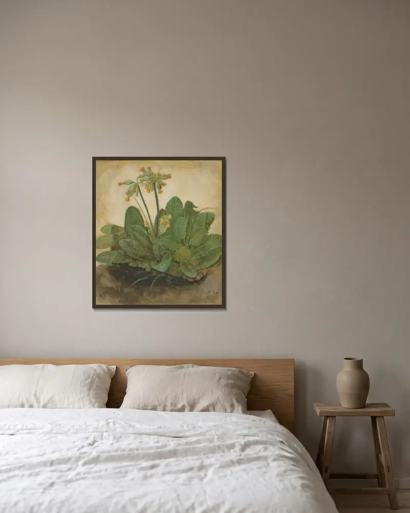 Tuft of Cowslips av Albrecht Dürer inramad på en vägg