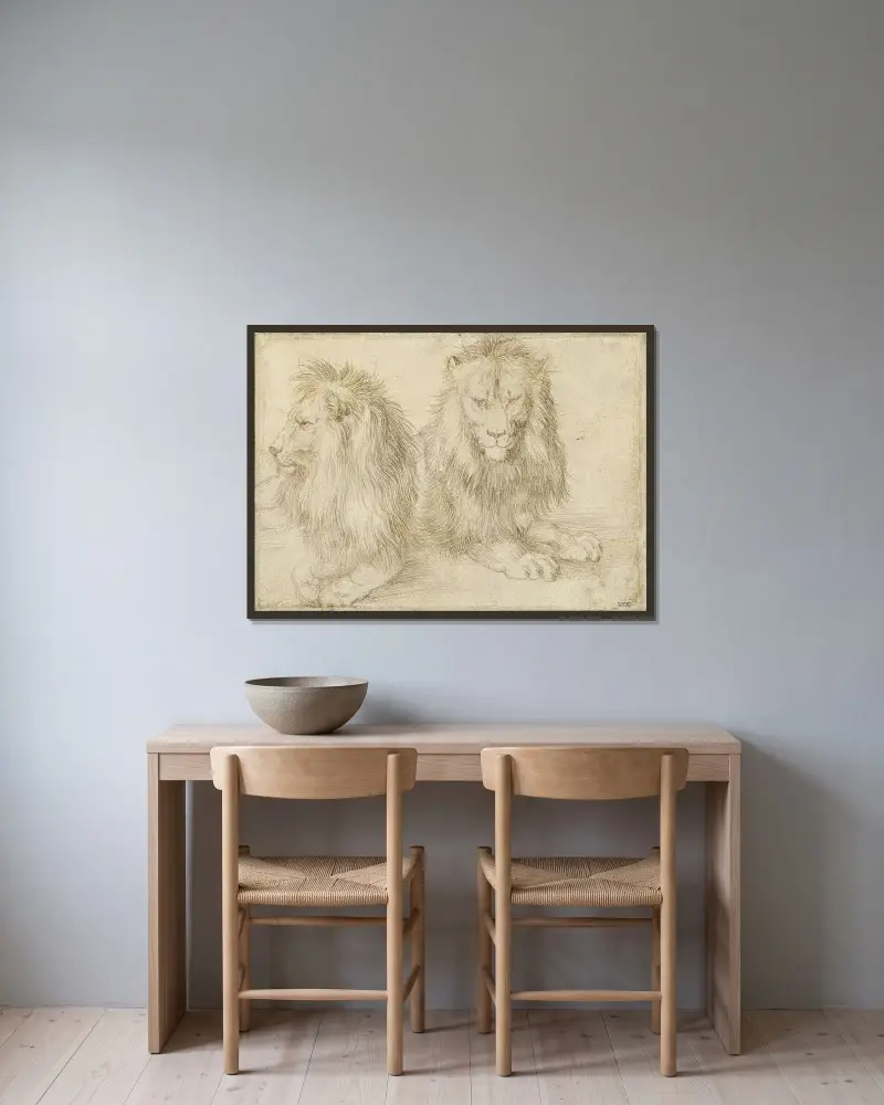 Zwei sitzende Löwen von Albrecht Dürer gerahmt an einer Wand