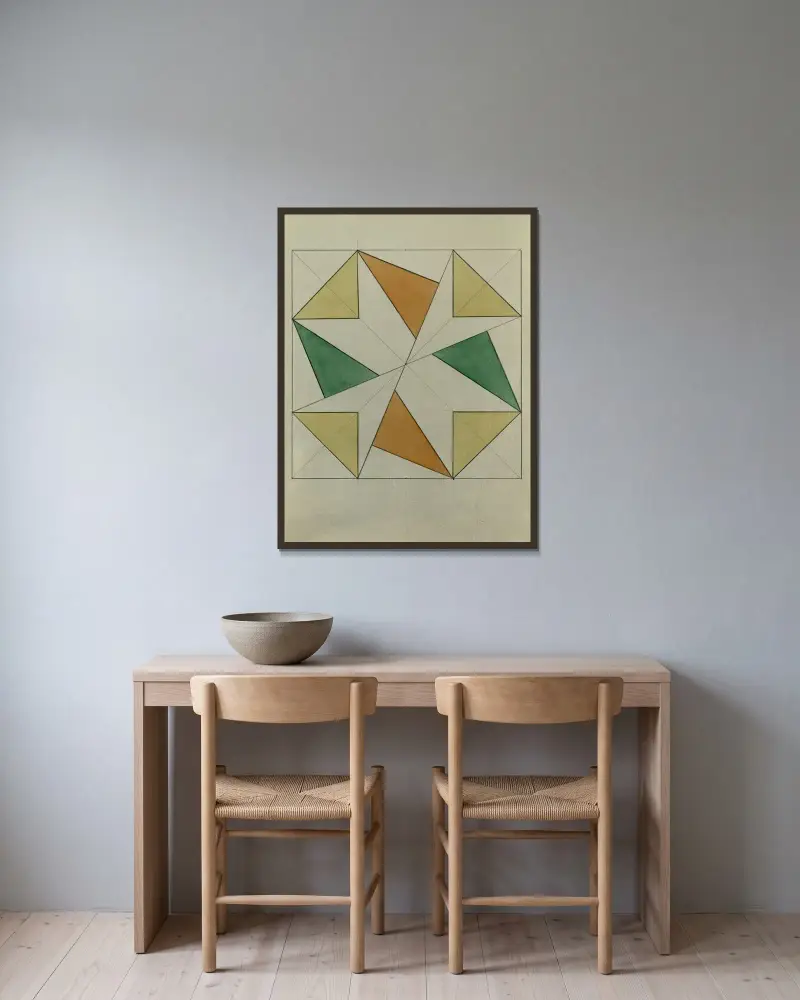 Fyrkant med trianglar av Alfred Ost inramad på en vägg