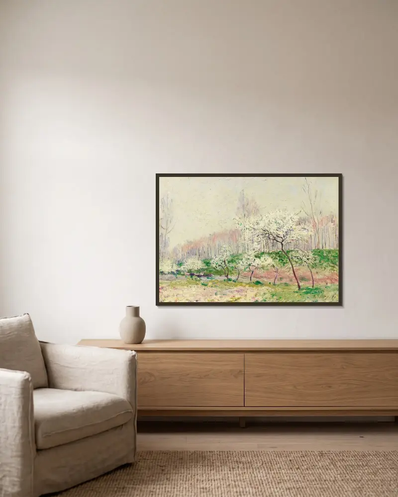Les Pommiers En Fleurs av Alfred Sisley inramad på en vägg
