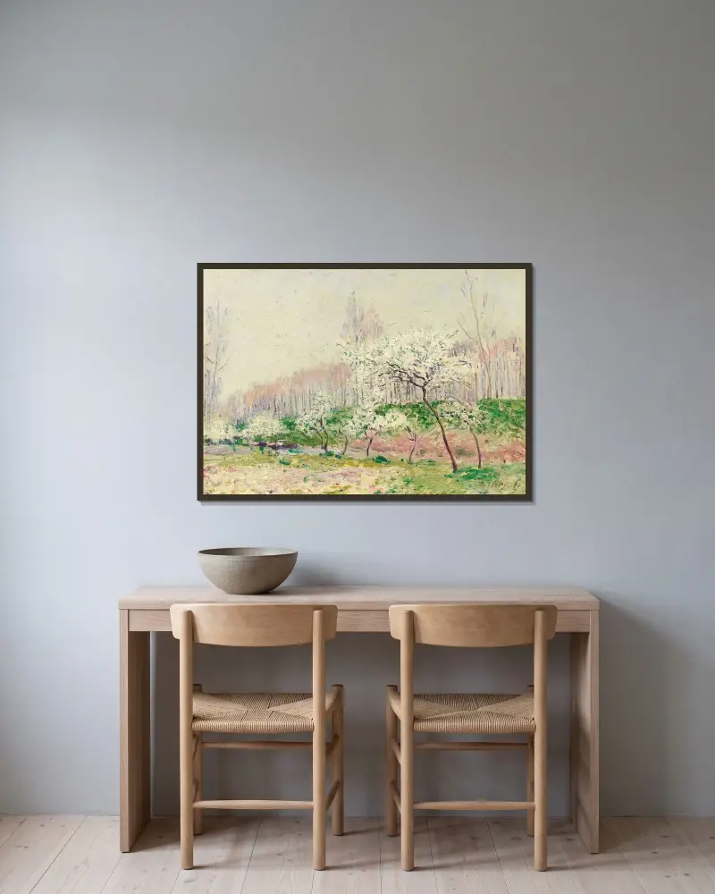 Les Pommiers En Fleurs av Alfred Sisley inramad på en vägg