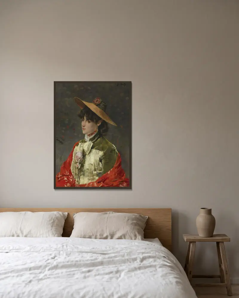 Kvinna med halmhatt av Alfred Stevens inramad på en vägg