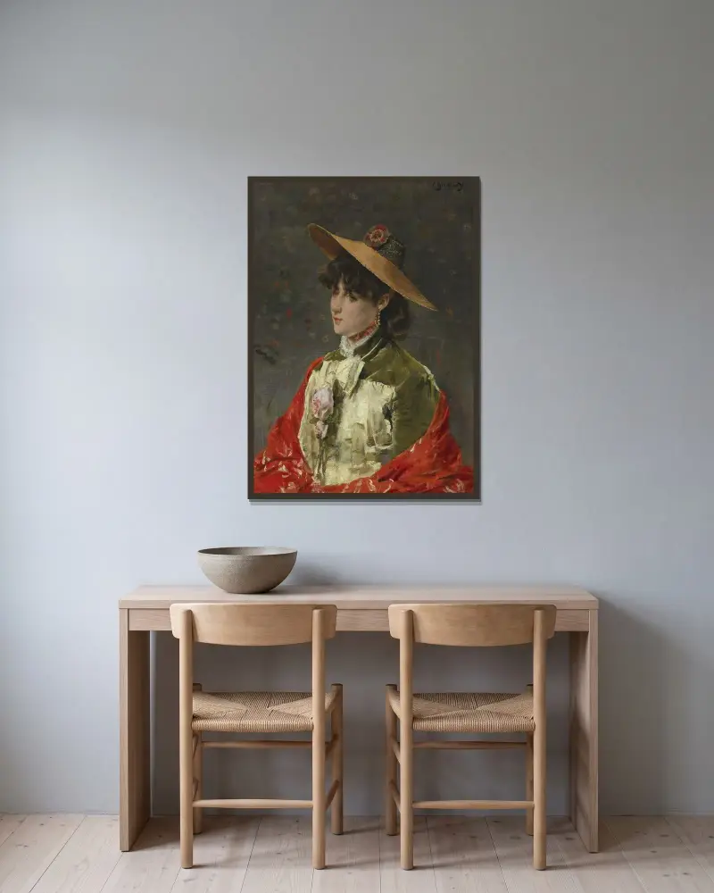 Kvinna med halmhatt av Alfred Stevens inramad på en vägg