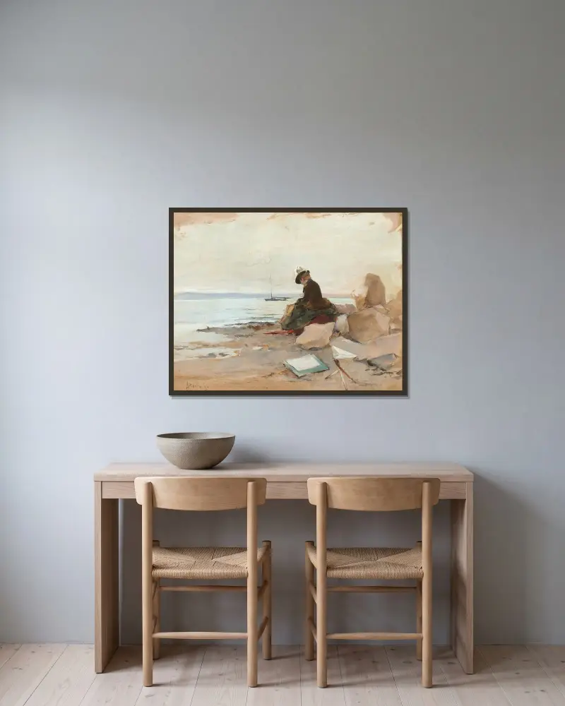Kvinna som målar vid havet av Alfred Stevens inramad på en vägg