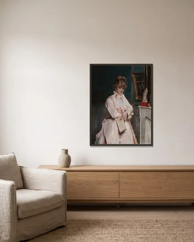 Ung kvinna med bok av Alfred Stevens inramad på en vägg