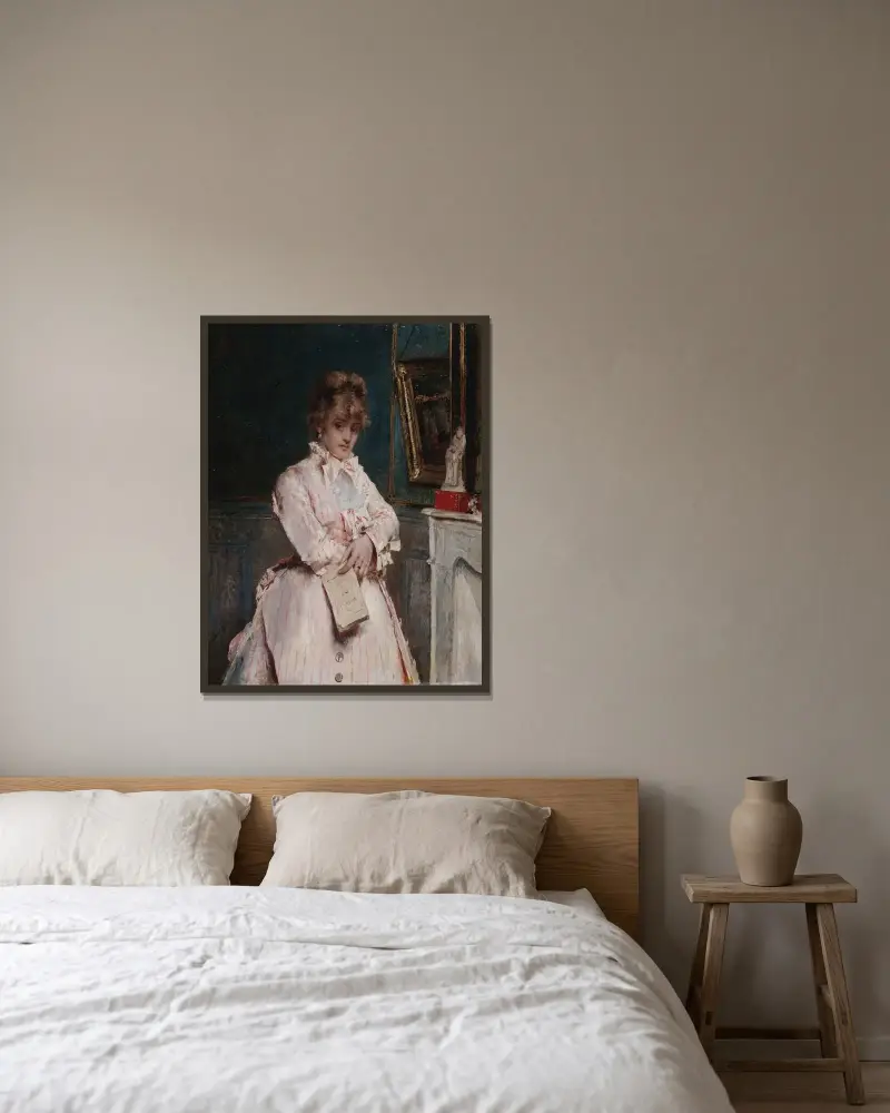 Ung kvinna med bok av Alfred Stevens inramad på en vägg