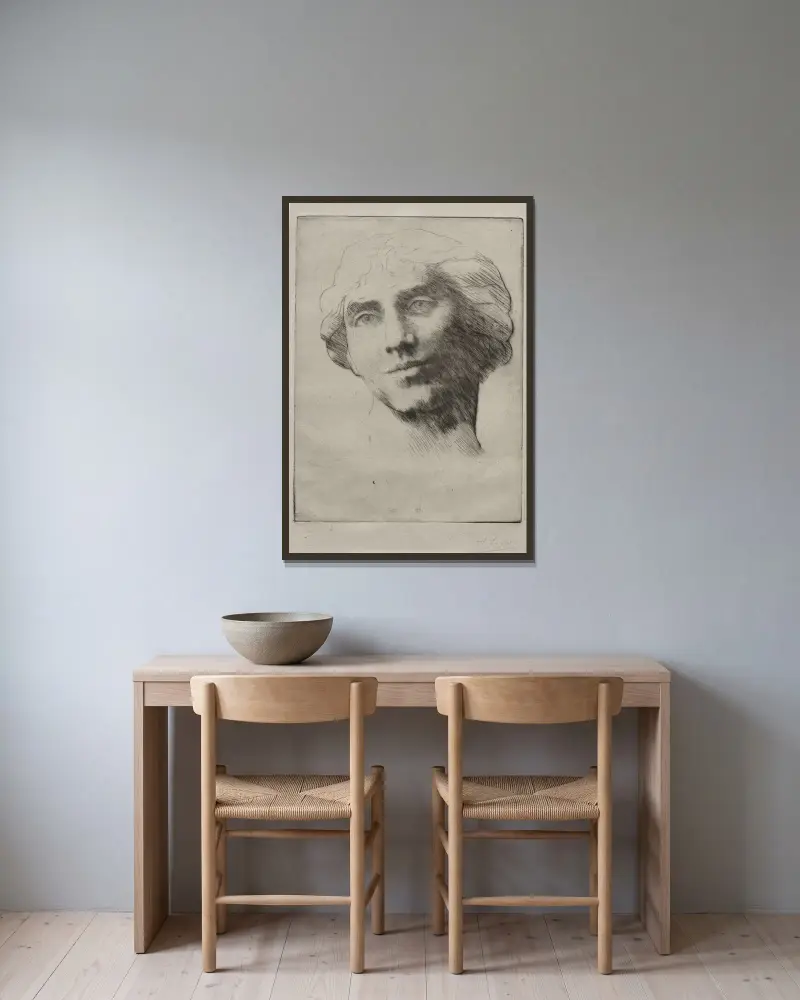 Ung kvinnas huvud av Alphonse Legros inramad på en vägg