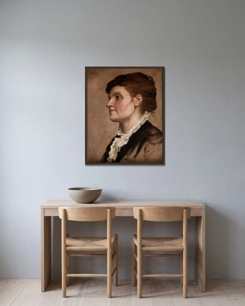 Kvinnopporträtt av Alphonse Legros inramad på en vägg