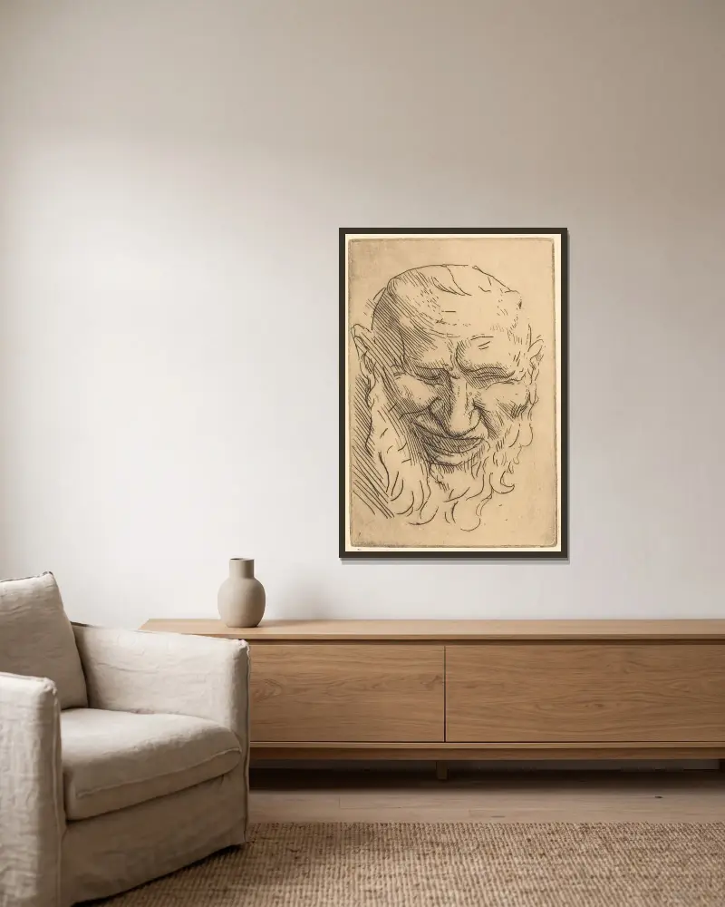 Liten satyrmask av Alphonse Legros inramad på en vägg