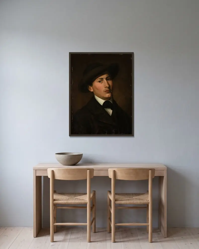 Självporträtt av Amaldus Nielsen inramad på en vägg