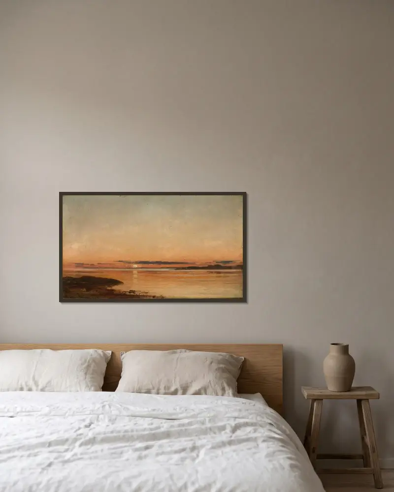 Solnedgång vid Fredrikstad av Amaldus Nielsen inramad på en vägg