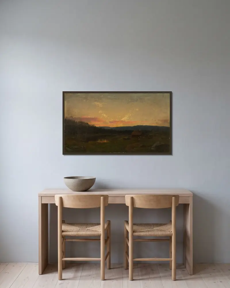 Solnedgång vid setern av Amaldus Nielsen inramad på en vägg