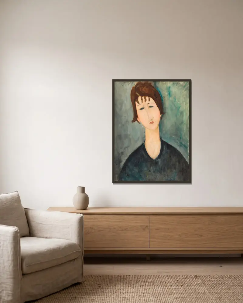 Frauenbildnis von Amedeo Modigliani gerahmt an einer Wand