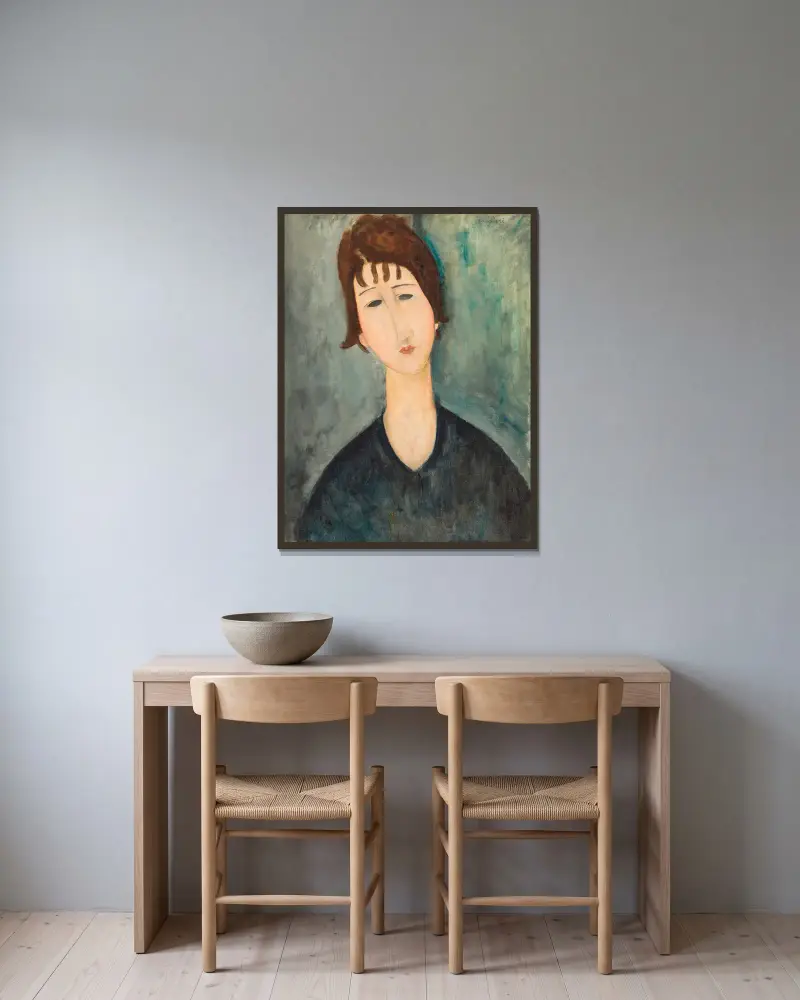 Frauenbildnis von Amedeo Modigliani gerahmt an einer Wand