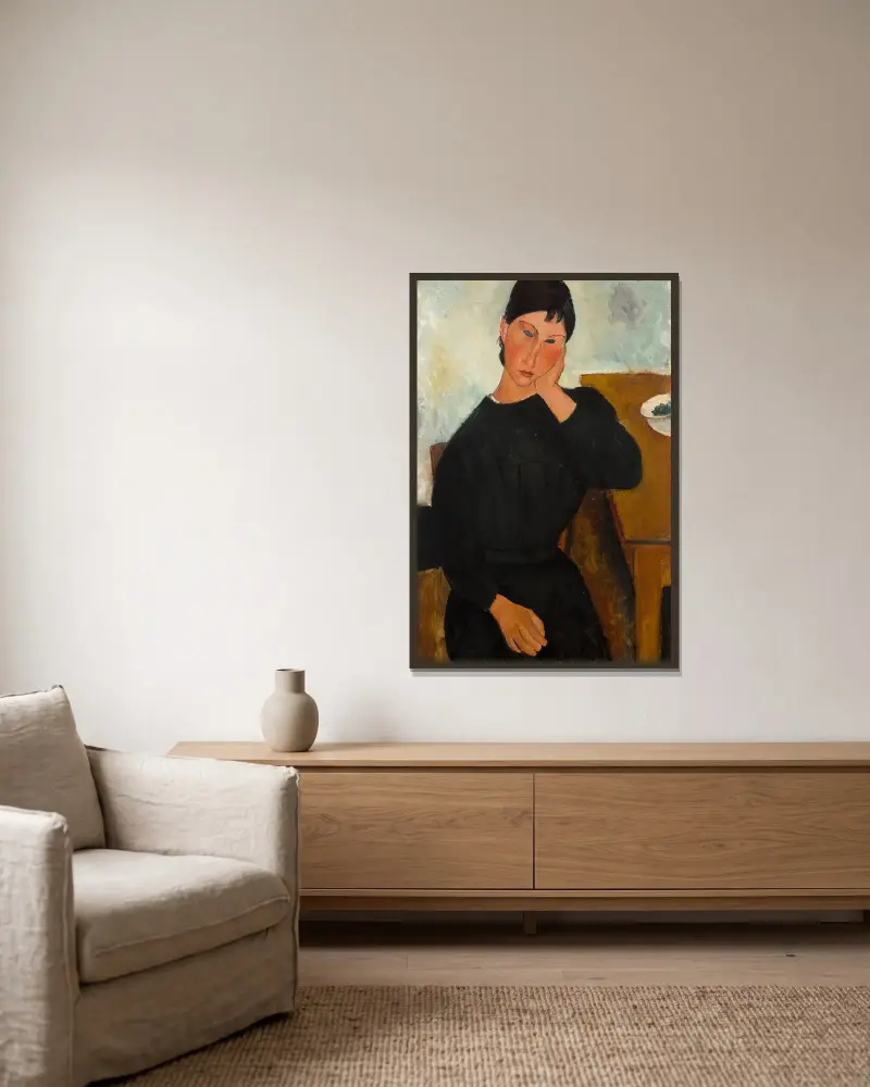 Elvira, an einem Tisch ruhend von Amedeo Modigliani gerahmt an einer Wand