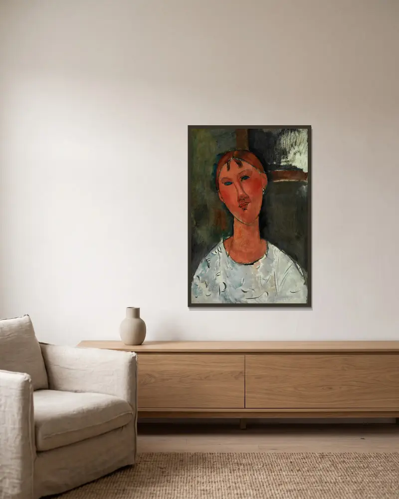Girl in a White Blouse av Amedeo Modigliani inramad på en vägg