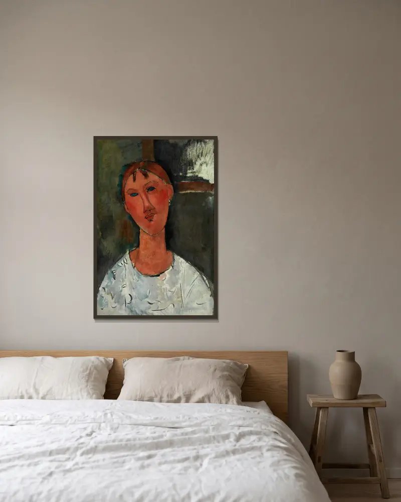 Girl in a White Blouse av Amedeo Modigliani inramad på en vägg