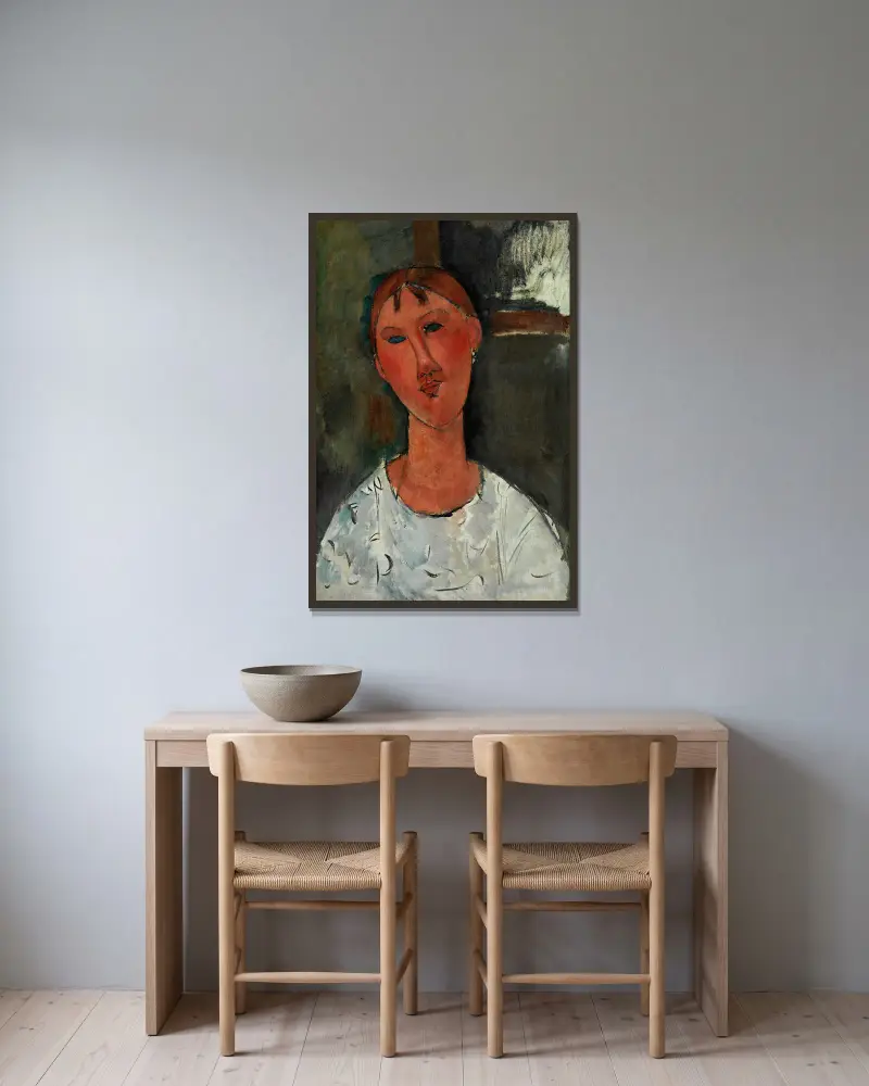 Girl in a White Blouse av Amedeo Modigliani inramad på en vägg