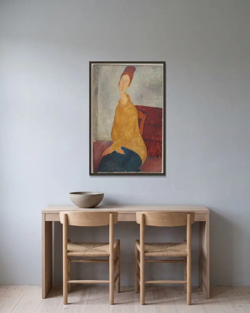 Jeanne Hébuterne in yellow sweater av Amedeo Modigliani inramad på en vägg