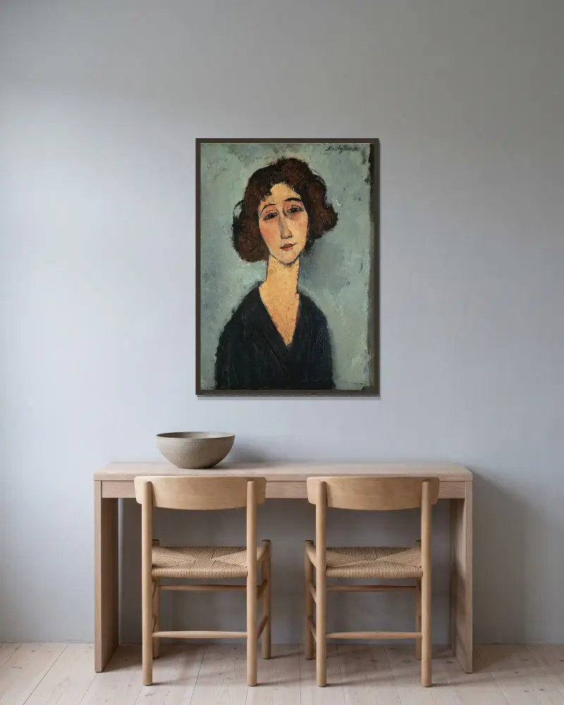 Jeune Femme av Amedeo Modigliani inramad på en vägg