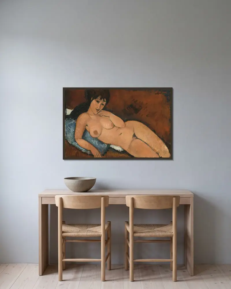 Nude on a Blue Cushion av Amedeo Modigliani inramad på en vägg