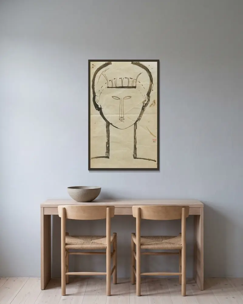 Kopf von Amedeo Modigliani gerahmt an einer Wand
