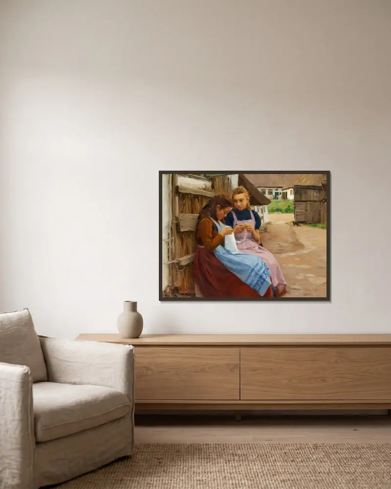 Två flickor med handarbete sittande på en gårdsplan av Hans Andersen Brendekilde inramad på en vägg