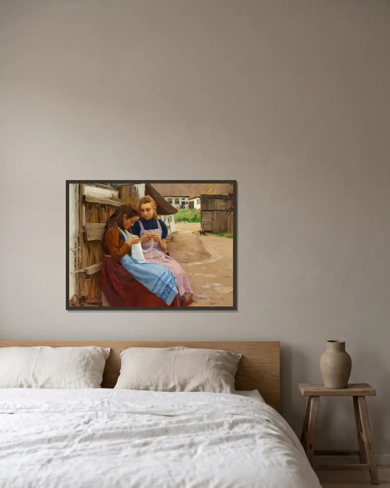 Två flickor med handarbete sittande på en gårdsplan av Hans Andersen Brendekilde inramad på en vägg