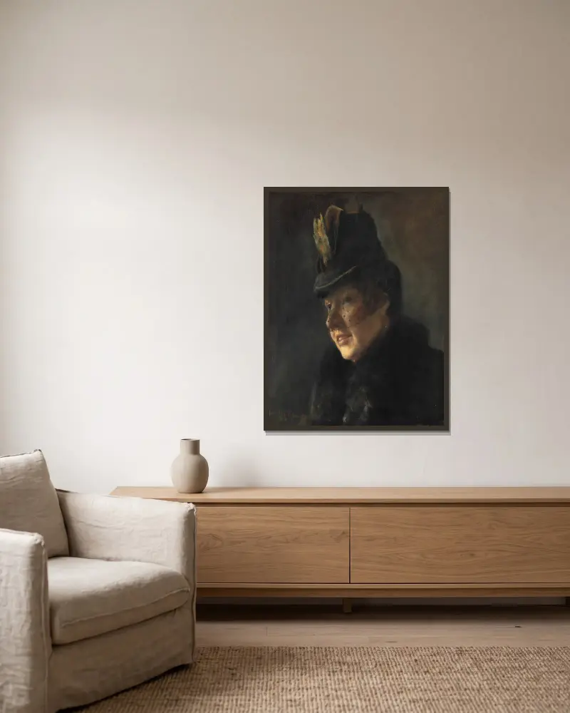 Portræt af en ung kvinde i frakke med pelskrave og hat med slør av Laurits Andersen Ring inramad på en vägg