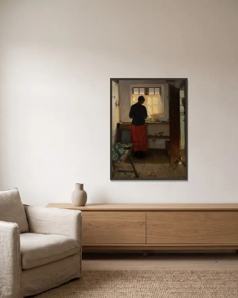 Das Mädchen in der Küche von Anna Ancher gerahmt an einer Wand