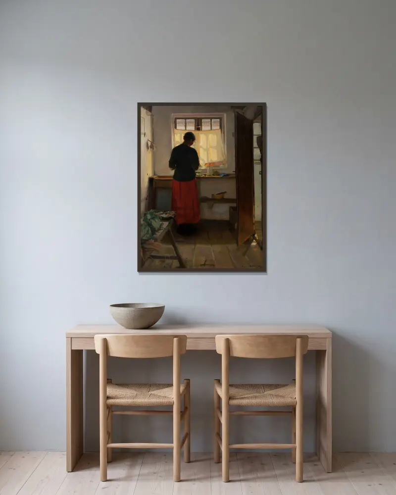 Das Mädchen in der Küche von Anna Ancher gerahmt an einer Wand