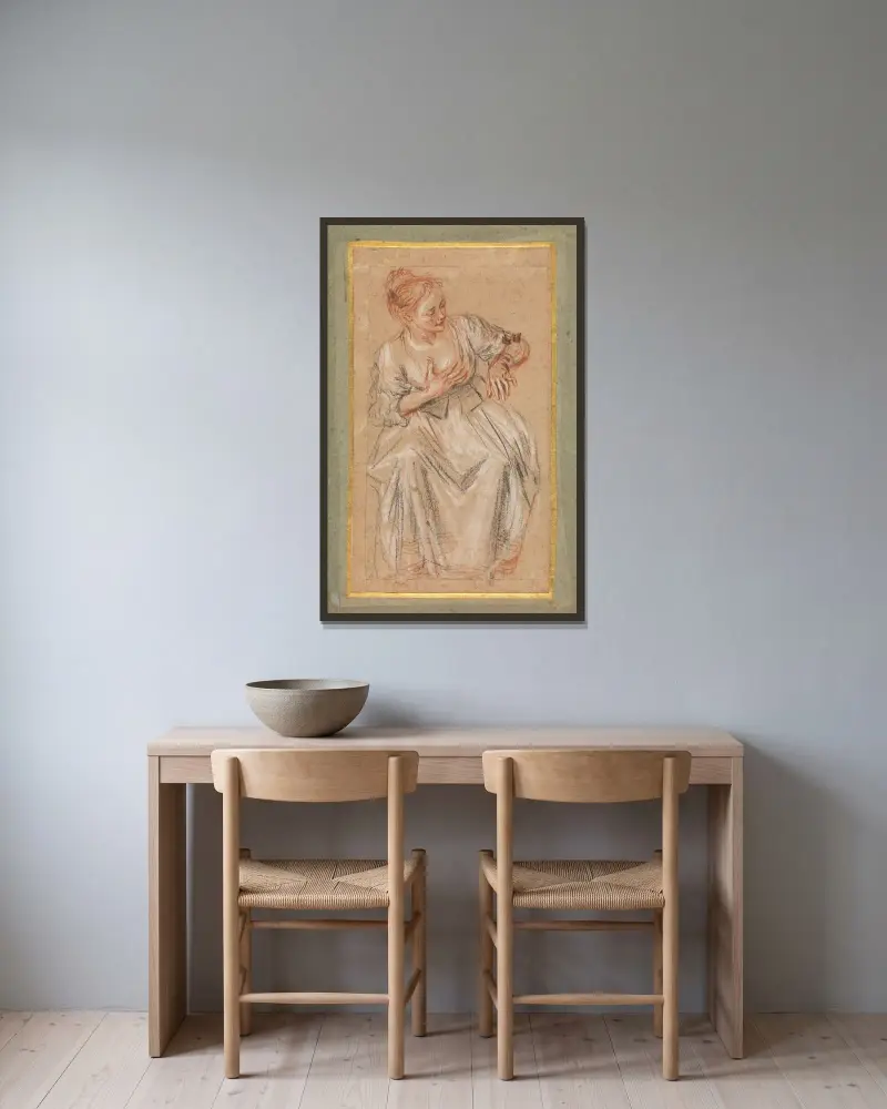Sittande kvinna av Jean-Antoine Watteau inramad på en vägg