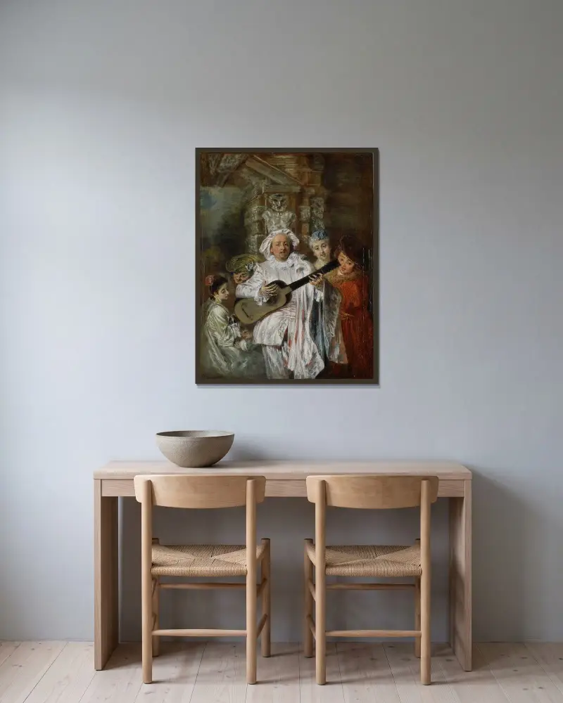 I Mezetins dräkt av Jean-Antoine Watteau inramad på en vägg