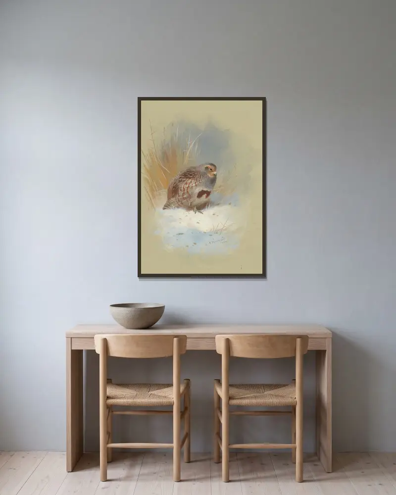 Ett rapphöns i snön av Archibald Thorburn inramad på en vägg