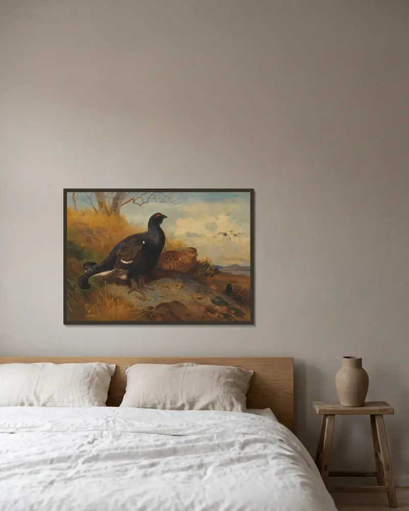 Orrar på klipphäll, med sjö i bakgrunden av Archibald Thorburn inramad på en vägg
